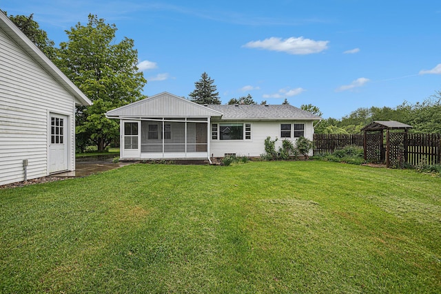 7432 Burlingame Ave SW, Byron Center, MI 49315 - back of house featuring a sunroom and a shingled roof
