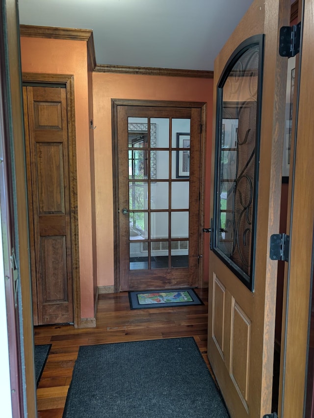 6919 Abrahamson Rd, Ludington, MI 49431 - foyer entrance featuring wood finished floors and crown molding