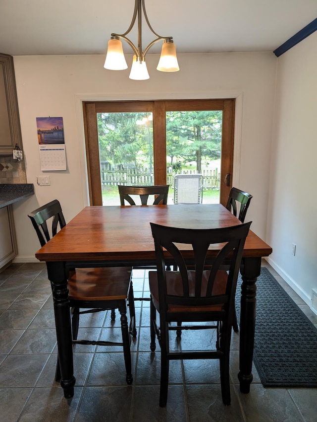6919 Abrahamson Rd, Ludington, MI 49431 - dining room featuring baseboards