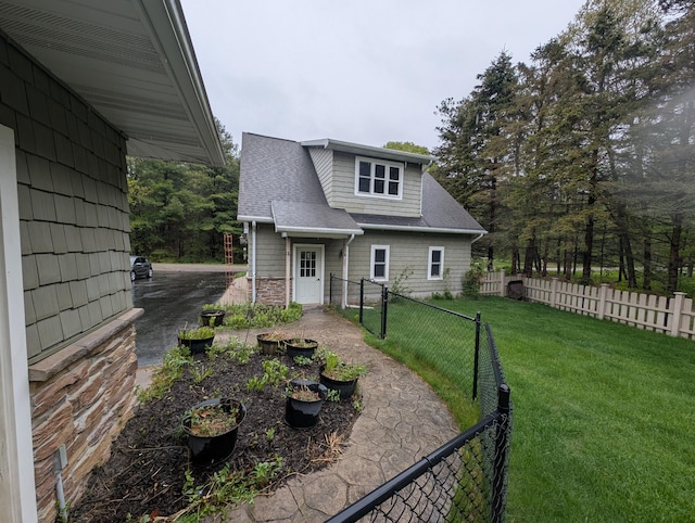 6919 Abrahamson Rd, Ludington, MI 49431 - view of front of home with a shingled roof