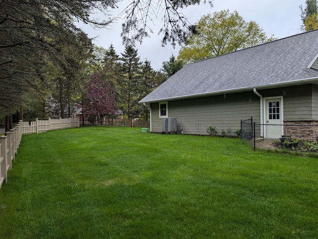 6919 Abrahamson Rd, Ludington, MI 49431 - view of yard featuring central air condition unit