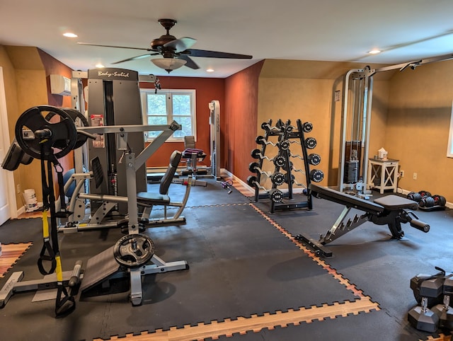 6919 Abrahamson Rd, Ludington, MI 49431 - exercise room featuring a ceiling fan, baseboards, and recessed lighting