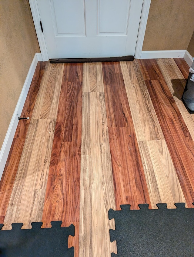 6919 Abrahamson Rd, Ludington, MI 49431 - detailed view of baseboards and wood finished floors
