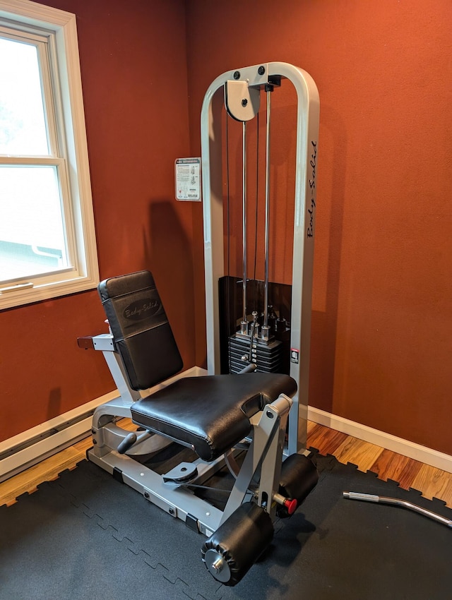 6919 Abrahamson Rd, Ludington, MI 49431 - workout area with wood finished floors and baseboards