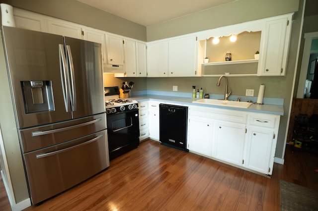 4314 Wilson Ave SW, Grandville, MI 49418 - kitchen featuring black appliances, a sink, under cabinet range hood, dark wood-style floors, and white cabinetry