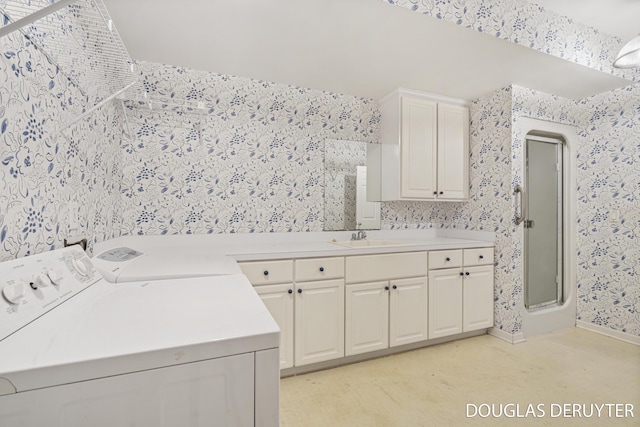 7470 Parmalee Rd, Middleville, MI 49333 - laundry area featuring wallpapered walls, independent washer and dryer, cabinet space, and light carpet