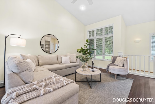 7470 Parmalee Rd, Middleville, MI 49333 - living area with wood finished floors, high vaulted ceiling, ceiling fan, and baseboards