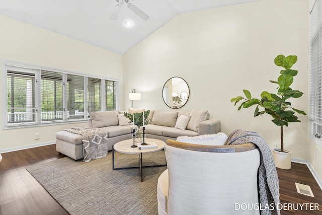 7470 Parmalee Rd, Middleville, MI 49333 - living room featuring ceiling fan, wood finished floors, baseboards, and high vaulted ceiling