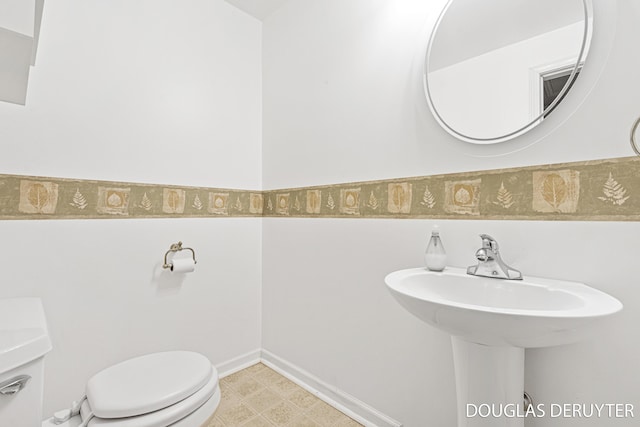 7470 Parmalee Rd, Middleville, MI 49333 - half bath with toilet and tile patterned floors