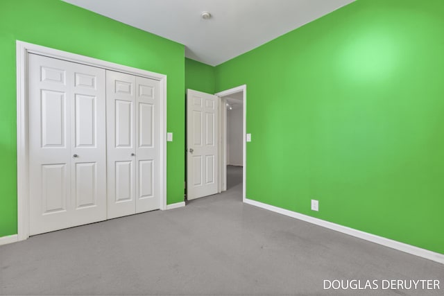7470 Parmalee Rd, Middleville, MI 49333 - unfurnished bedroom featuring carpet flooring, baseboards, and a closet