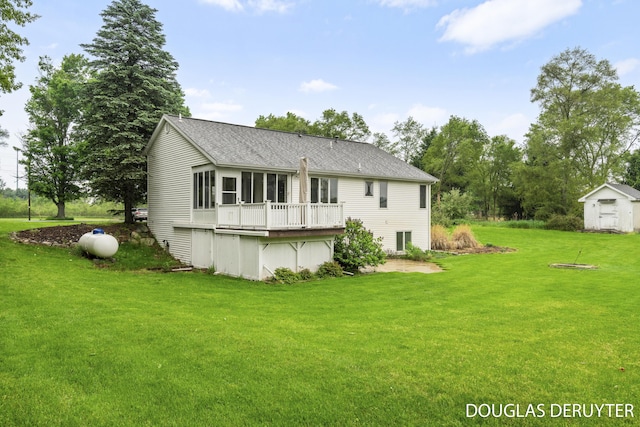 7470 Parmalee Rd, Middleville, MI 49333 - back of house with a yard, a deck, and a shingled roof