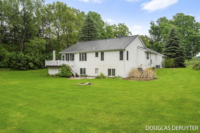 7470 Parmalee Rd, Middleville, MI 49333 - back of property featuring a yard, a wooden deck, and stairs