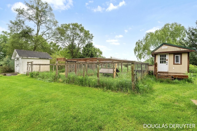 7470 Parmalee Rd, Middleville, MI 49333 - view of green lawn featuring an outdoor structure