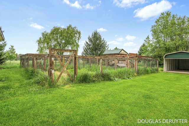 7470 Parmalee Rd, Middleville, MI 49333 - view of green lawn featuring a carport