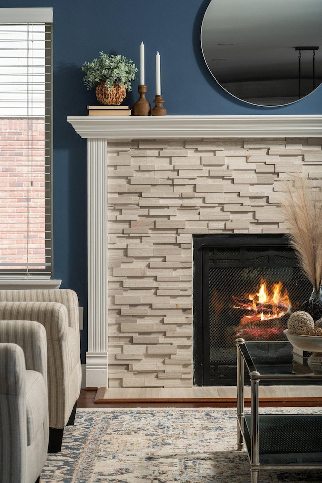 4139 Persimmon Dr, Ypsilanti, MI 48197 - detailed view of a warm lit fireplace and wood finished floors