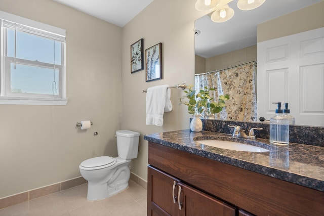 4139 Persimmon Dr, Ypsilanti, MI 48197 - full bathroom with baseboards, vanity, toilet, and tile patterned flooring