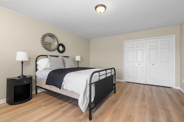 4139 Persimmon Dr, Ypsilanti, MI 48197 - bedroom with light wood-type flooring, baseboards, and a closet