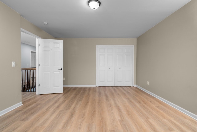 4139 Persimmon Dr, Ypsilanti, MI 48197 - unfurnished bedroom featuring light wood finished floors, baseboards, and a closet