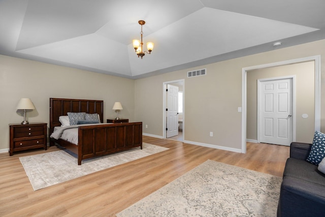 4139 Persimmon Dr, Ypsilanti, MI 48197 - bedroom with a chandelier, light wood finished floors, baseboards, and a tray ceiling
