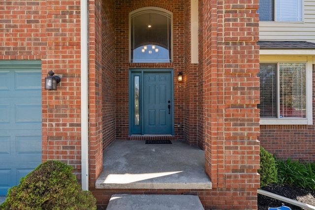 4139 Persimmon Dr, Ypsilanti, MI 48197 - doorway to property featuring brick siding and a garage