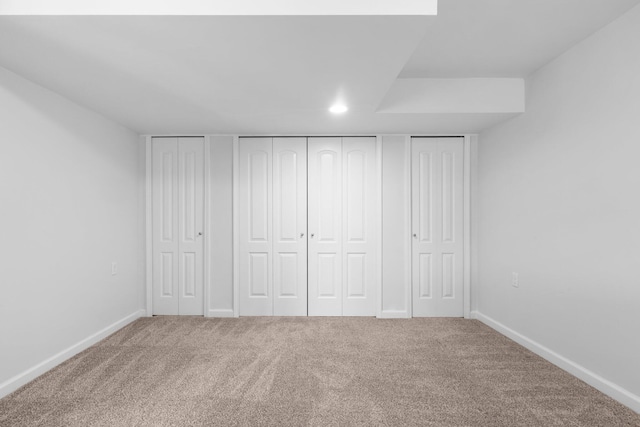4139 Persimmon Dr, Ypsilanti, MI 48197 - unfurnished bedroom featuring carpet floors, multiple closets, baseboards, and recessed lighting