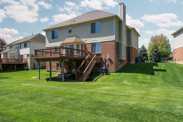 4139 Persimmon Dr, Ypsilanti, MI 48197 - rear view of property featuring a deck, stairs, brick siding, a chimney, and a yard