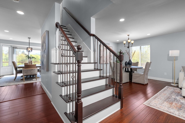 4139 Persimmon Dr, Ypsilanti, MI 48197 - stairs featuring a chandelier, hardwood / wood-style floors, recessed lighting, and baseboards