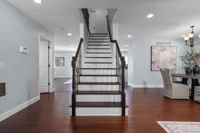 4139 Persimmon Dr, Ypsilanti, MI 48197 - stairway with baseboards, a chandelier, hardwood / wood-style floors, and recessed lighting