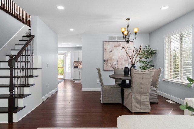 4139 Persimmon Dr, Ypsilanti, MI 48197 - dining room with a chandelier, stairs, recessed lighting, dark wood-type flooring, and baseboards