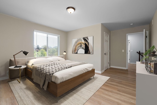 4139 Persimmon Dr, Ypsilanti, MI 48197 - bedroom featuring light wood-type flooring and baseboards