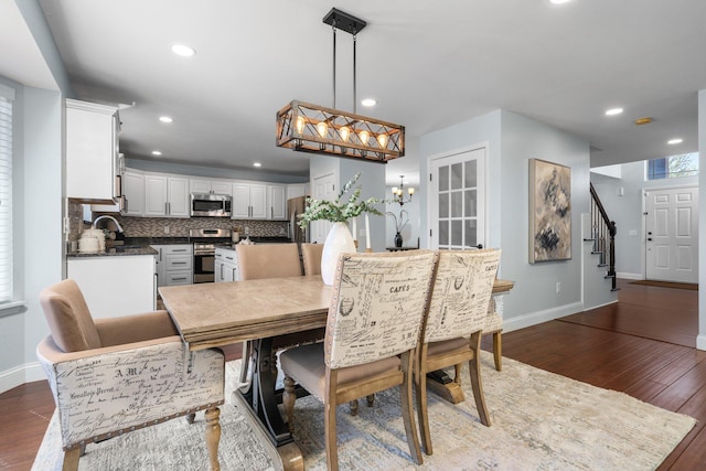 4139 Persimmon Dr, Ypsilanti, MI 48197 - dining space with dark wood-style floors, stairway, baseboards, and recessed lighting