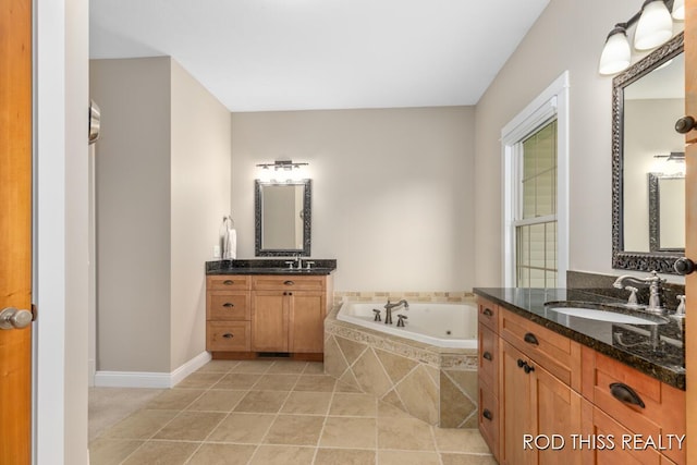 12644 60th Ave, Allendale, MI 49401 - bathroom with a whirlpool tub, two vanities, tile patterned floors, and baseboards