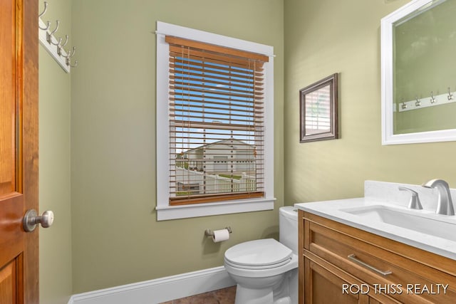 12644 60th Ave, Allendale, MI 49401 - half bath with vanity, toilet, baseboards, and tile patterned floors