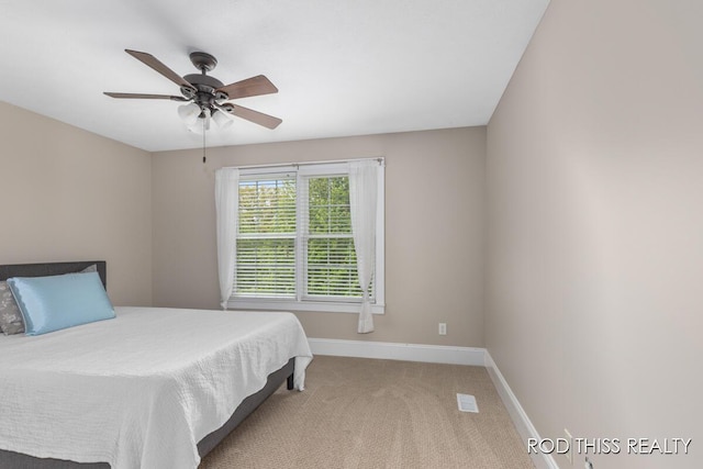 12644 60th Ave, Allendale, MI 49401 - bedroom featuring carpet floors, baseboards, and ceiling fan