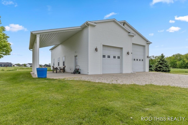 12644 60th Ave, Allendale, MI 49401 - view of home's exterior featuring a yard, gravel driveway, and a garage