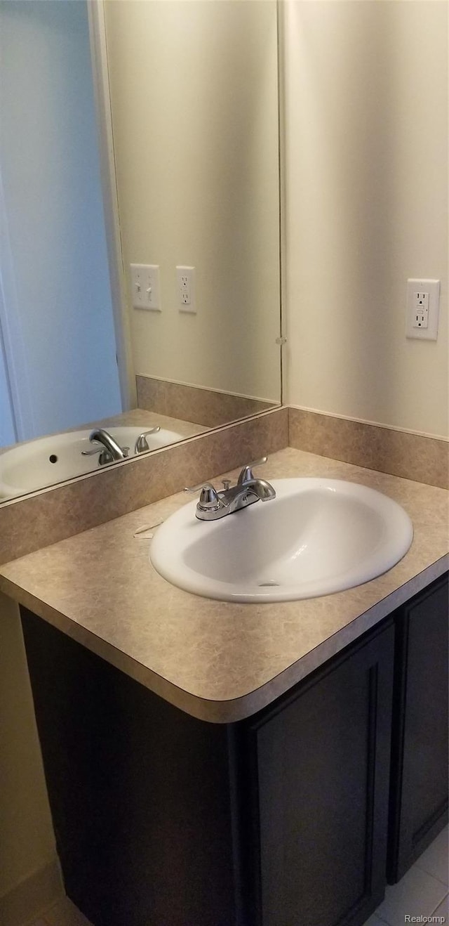 27615 Hidden Oaks Dr Unit 16, Trenton, MI 48183 - bathroom featuring vanity and tile patterned floors