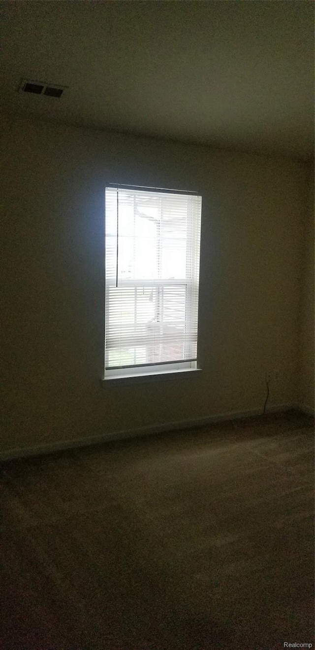 27615 Hidden Oaks Dr Unit 16, Trenton, MI 48183 - empty room featuring dark carpet