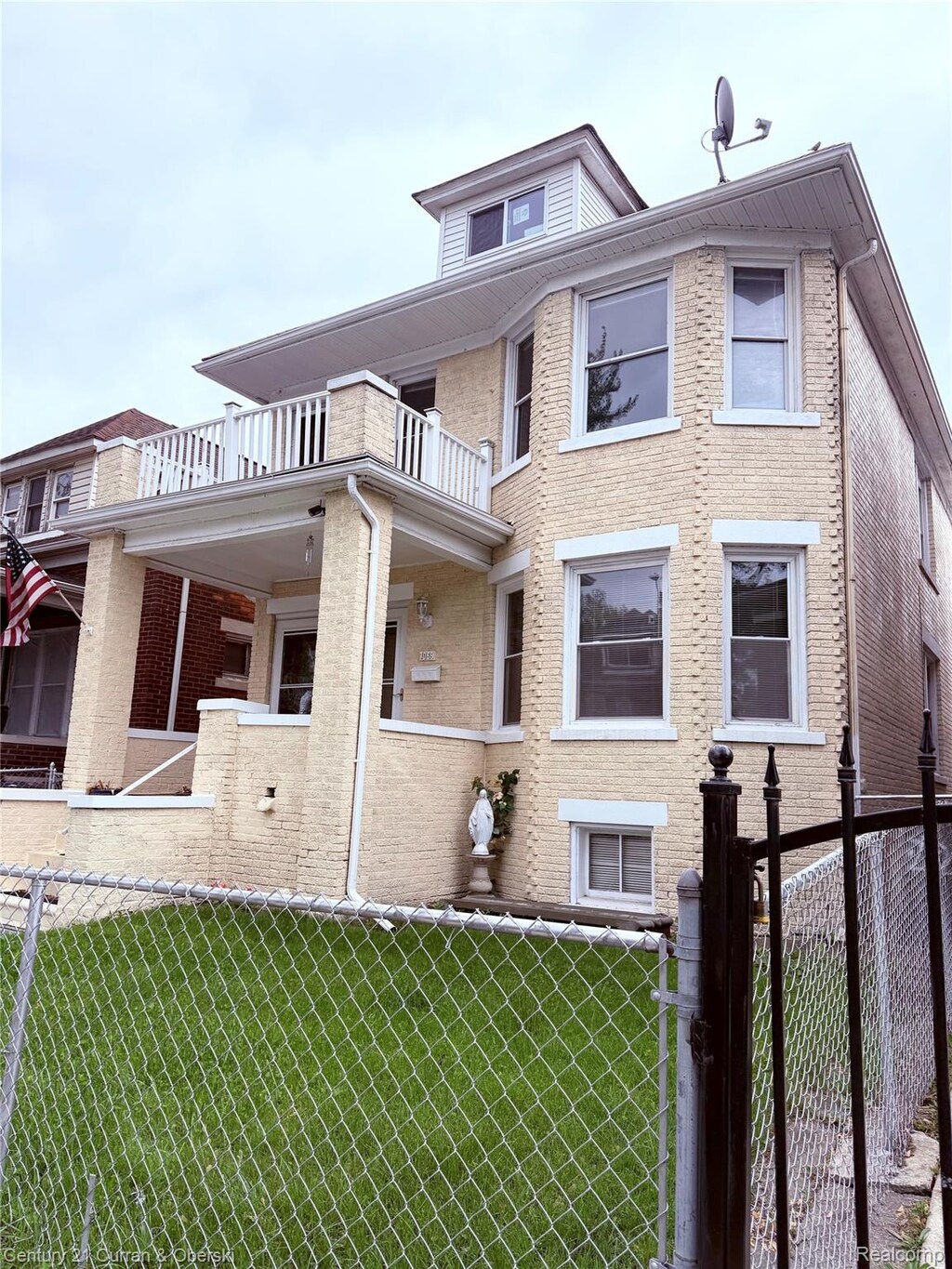 7067 Lexington St, Detroit, MI 48209 - view of side of home with a balcony and brick siding