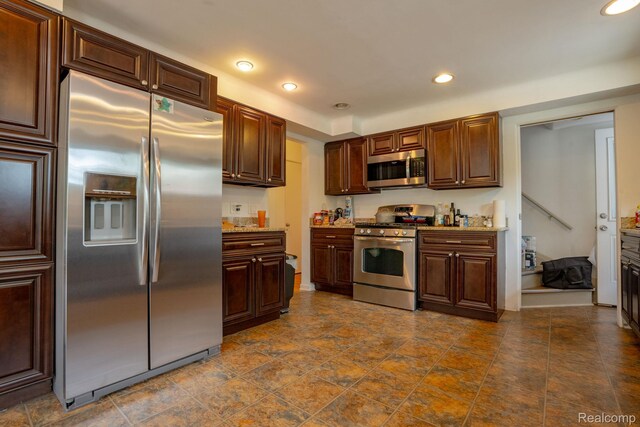 622 Sunningdale Dr, Grosse Pointe Woods, MI 48236 - kitchen featuring stainless steel appliances, recessed lighting, light stone counters, baseboards, and dark brown cabinets