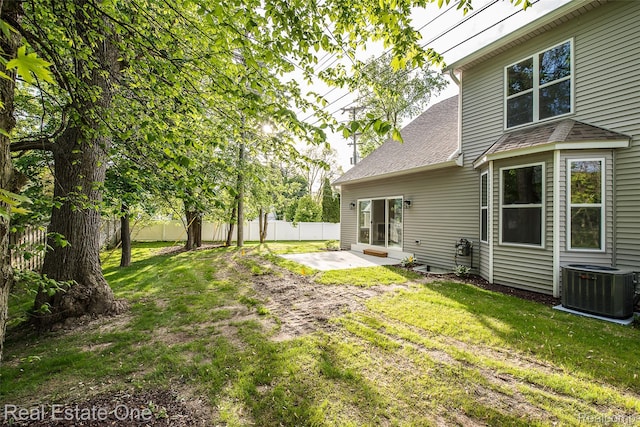 527 Indian Oaks Dr, Howell, MI 48843 - view of yard featuring central AC and a patio area
