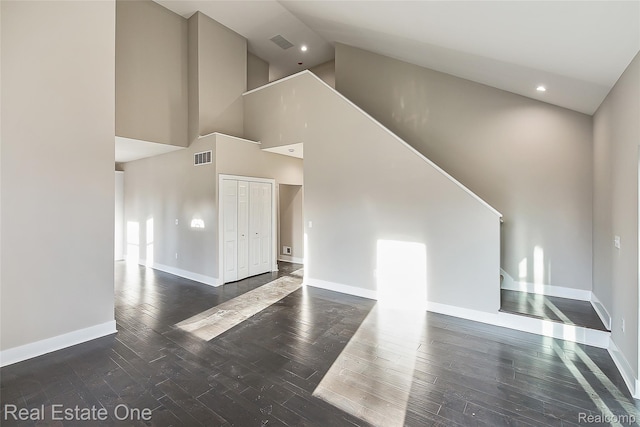 527 Indian Oaks Dr, Howell, MI 48843 - unfurnished living room with high vaulted ceiling, hardwood / wood-style flooring, baseboards, and recessed lighting