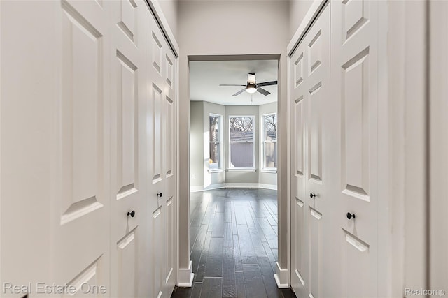 527 Indian Oaks Dr, Howell, MI 48843 - corridor featuring dark wood-style floors and baseboards