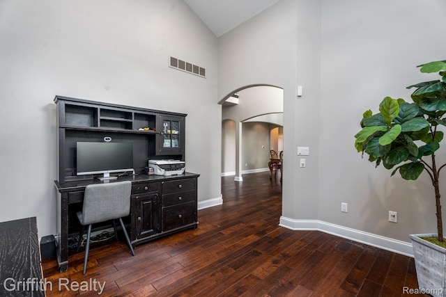 1804 Morgan Lake Ct, Brighton, MI 48114 - office space featuring arched walkways, dark wood finished floors, baseboards, and high vaulted ceiling