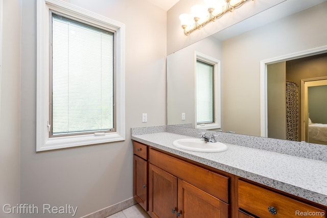 1804 Morgan Lake Ct, Brighton, MI 48114 - bathroom with vanity, plenty of natural light, and tile patterned flooring