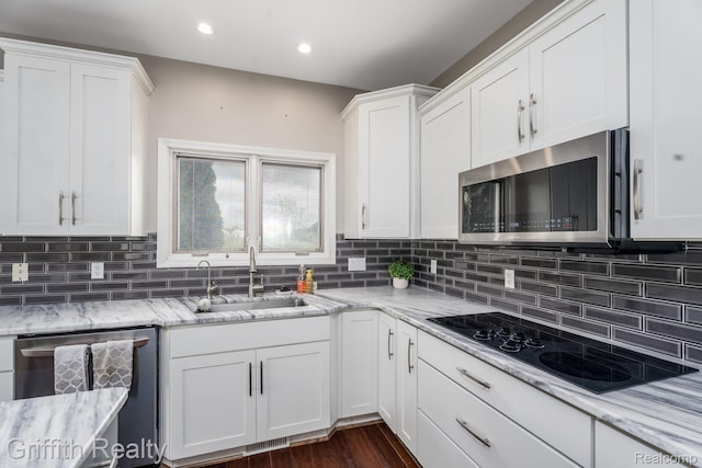1804 Morgan Lake Ct, Brighton, MI 48114 - kitchen featuring appliances with stainless steel finishes, a sink, white cabinets, decorative backsplash, and recessed lighting