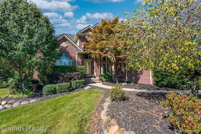 1804 Morgan Lake Ct, Brighton, MI 48114 - view of front of house featuring brick siding and a front yard