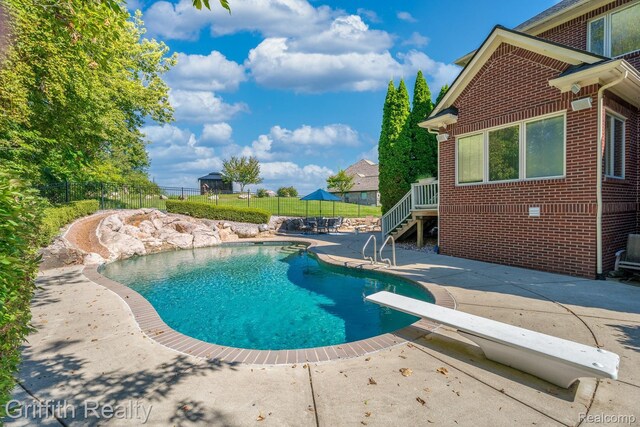 1804 Morgan Lake Ct, Brighton, MI 48114 - view of pool with a patio and a diving board