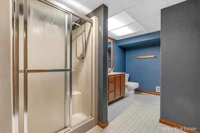 4700 M-79, Nashville, MI 49073 - full bathroom with baseboards, a stall shower, vanity, toilet, and a drop ceiling