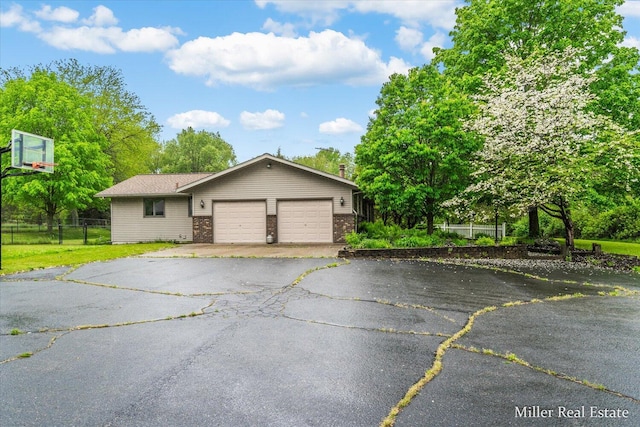 4700 M-79, Nashville, MI 49073 - view of front of property featuring an attached garage, driveway, and brick siding