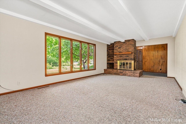 4700 M-79, Nashville, MI 49073 - unfurnished living room with beam ceiling, carpet flooring, a brick fireplace, and baseboards